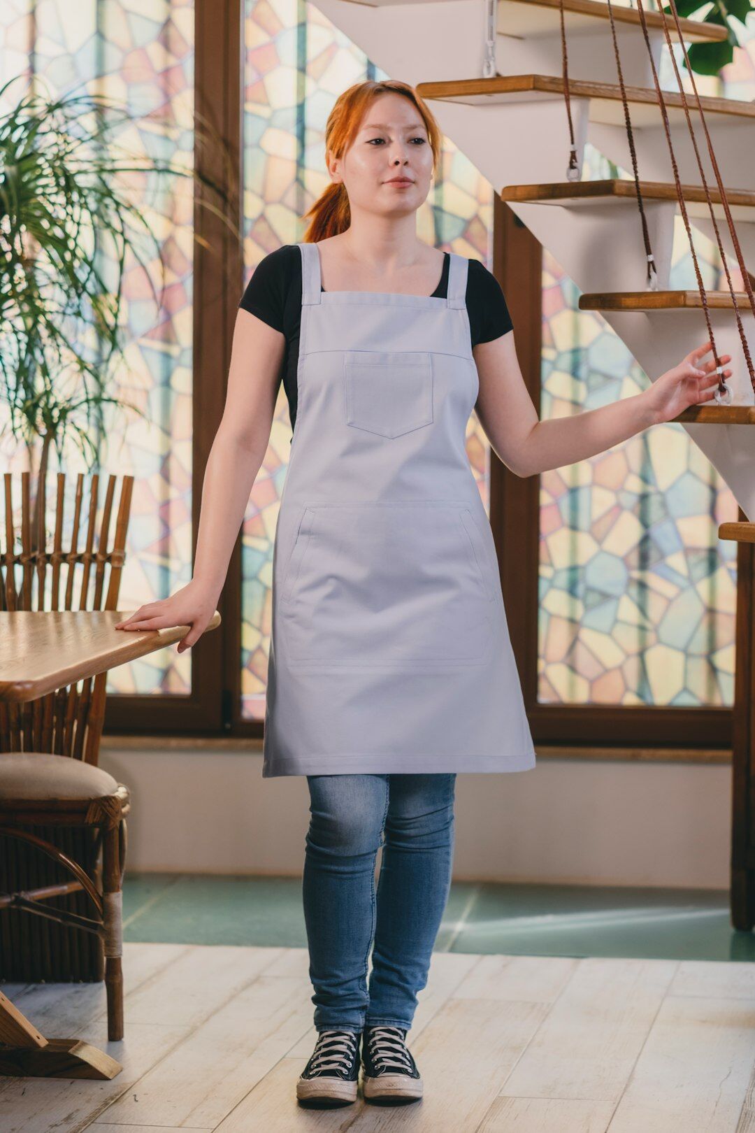 Middle aged Czech woman cooking in a bright home kitchen